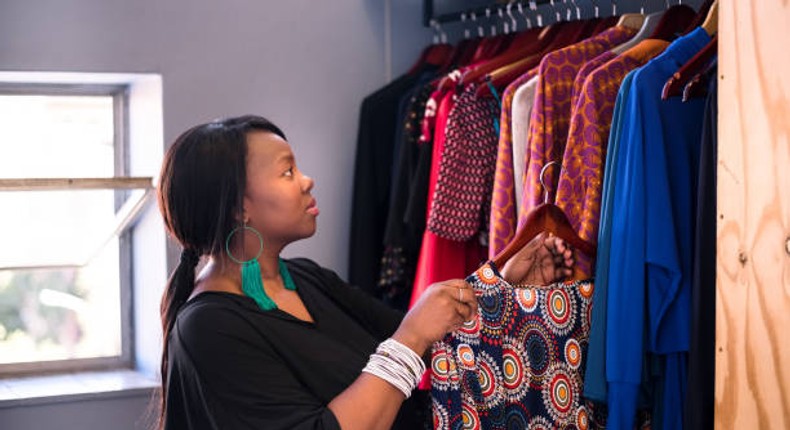 A woman arranging her wardrobe