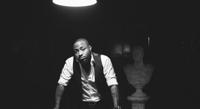 Davido leans against a pool table for his Native magazine shoot [Native]