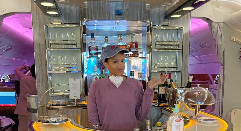 I splurged my miles to fly Emirates' luxe business class. I ate a multi ...