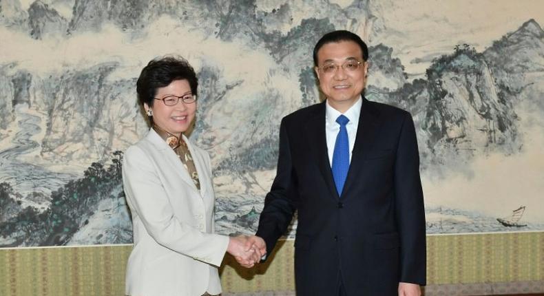 Hong Kong chief executive-elect Carrie Lam (left) shakes hands with Chinese Premier Li Keqiang ahead of talks in Beijing, on April 11, 2017