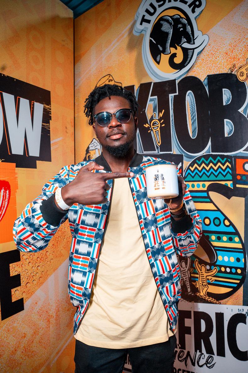 Fashion Designer Bevern Oguk, founder of the BOGUK Clothing Line, poses in one of his outfits at theTusker OktobaFest Kisumu, which took place at Black Pearl Lounge and Grill in Kisumu.