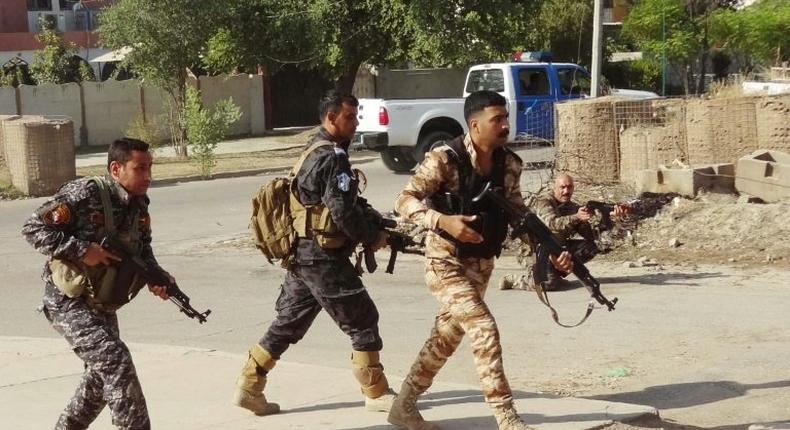 Iraqi Kurdish security forces patrol a street in the southern suburbs of Kirkuk after jihadist gunmen attacked the city, on October 22, 2016