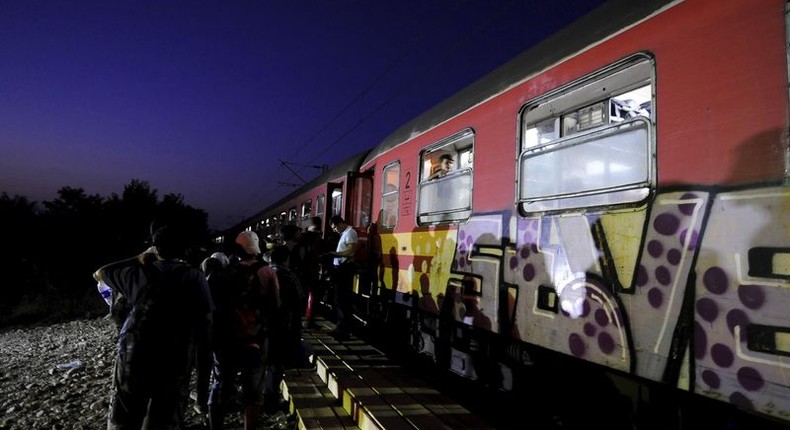 Migrants wait to get on a train after crossing into Macedonia, near the border with Greece, August 31, 2015. REUTERS/Ognen Teofilovski