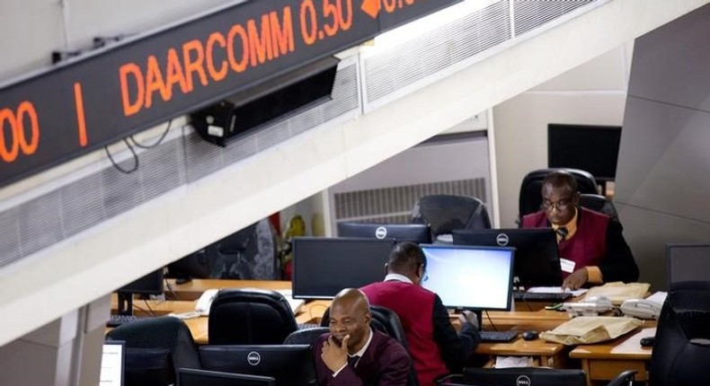 Traders work at the Nigerian Stock Exchange in Lagos, February 13, 2015. REUTERS/Joe Penney