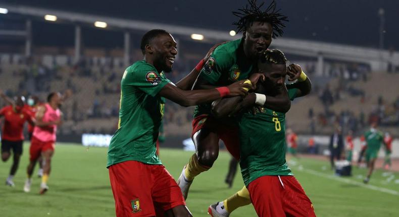 Ambroise Oyongo (R) is mobbed by team-mates after scoring the winning penalty in the shootout against Burkina Faso Creator: Kenzo TRIBOUILLARD