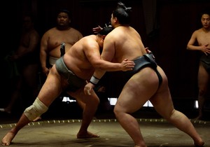 Shadows of Strength: Sumo Wrestlers Face Off in Low Key Training