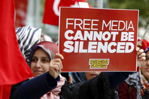 Supporters of Gulen movement shout slogans during a protest outside the Kanalturk and Bugun TV build