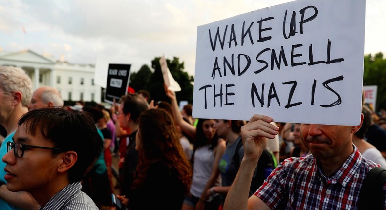 People gather for a vigil in response to the death of a counter-demonstrator at the Unite the Right rally in Charlottesville, outside the White House in Washington, U.S. August 13, 2017.