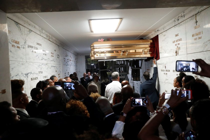 Flowers are seen on the casket of the late singer Aretha Franklin as it is laid to rest at her buria