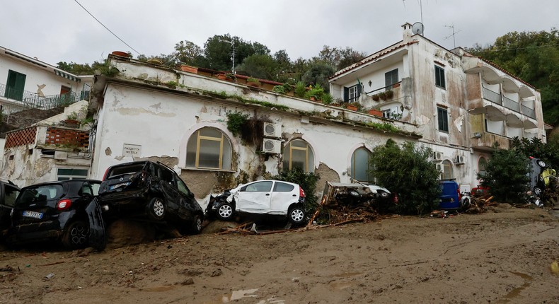 Damaged cars lie at a street following a landslide on the Italian holiday island of Ischia, Italy November 26, 2022.REUTERS/Ciro de Luca