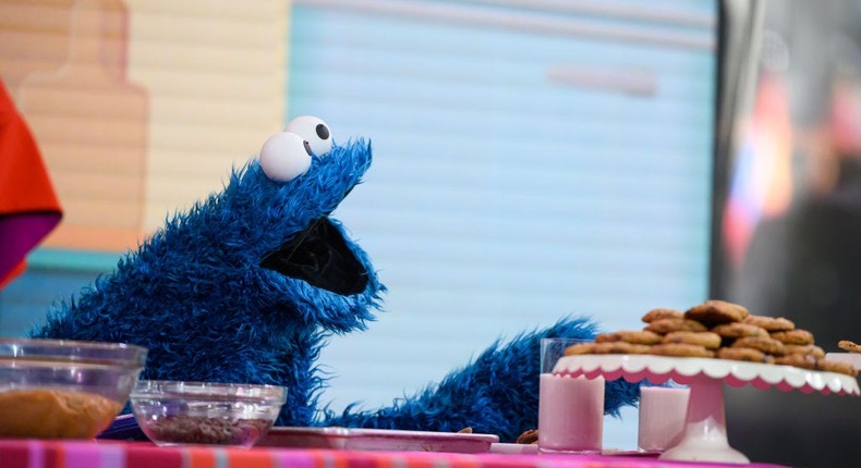 Cookie Monster reaching toward a plate of cookies.Nathan Congleton/NBC/NBCU Photo Bank via Getty Images