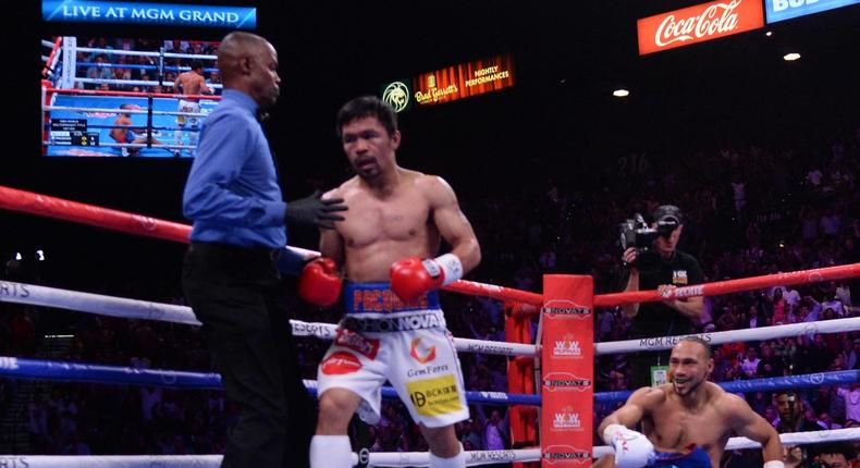 Manny Pacquiao knocks Keith Thurman down in the first round.JPG