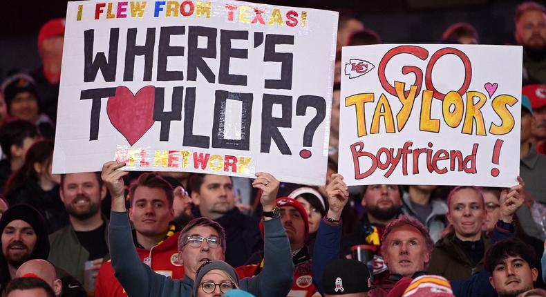 Fans attend a Kansas City Chiefs game with Taylor Swift signs.KIRILL KUDRYAVTSEV/AFP via Getty Images