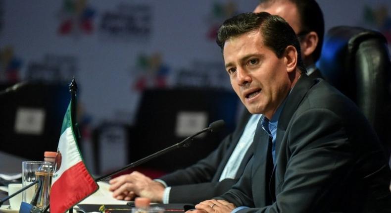 Mexican President Enrique Pena Nieto, seen here at a summit in Colombia, meets later this week in Germany with US President Donald Trump but Mexican officials are downplaying expectations of any settling of their substantive differences