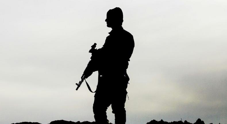 A member of the Syrian Democratic Forces (SDF), made up of US-backed Kurdish and Arab fighters, stands guard near the village of Bir Fawaz, 20 km north of Raqa, on February 8, 2017