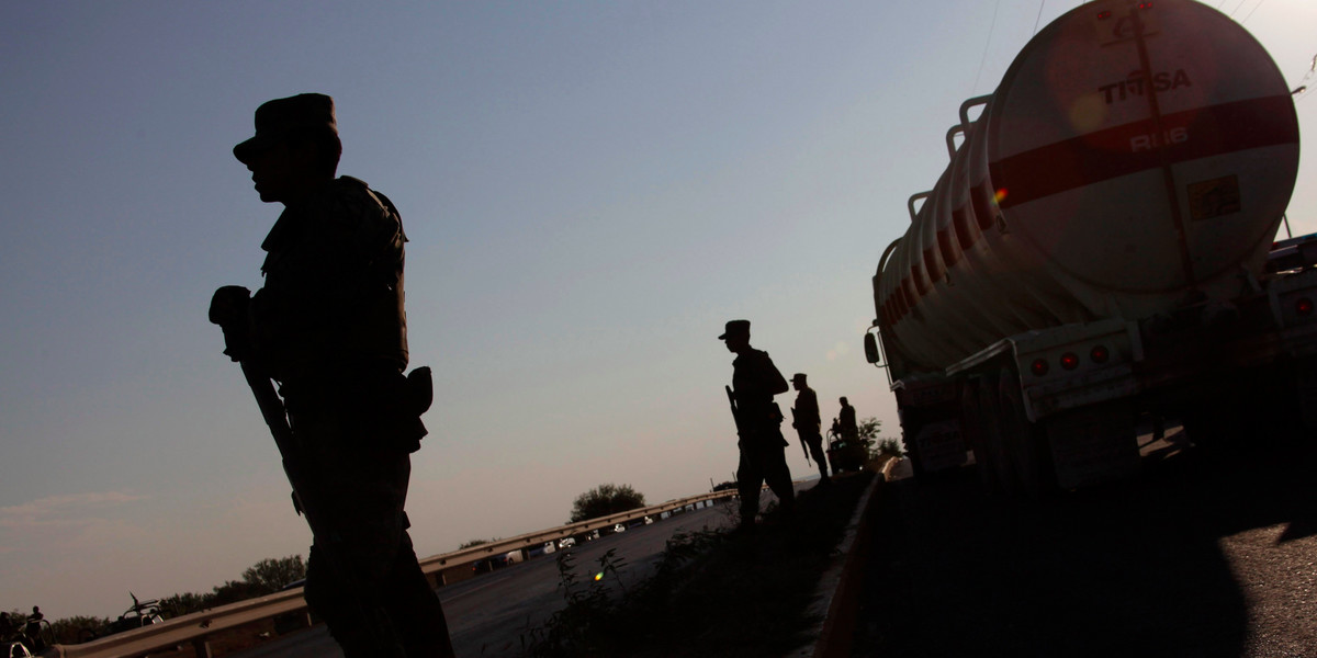 Soldiers stand guard at a gas facility of Pemex in Reynosa September 18, 2012.