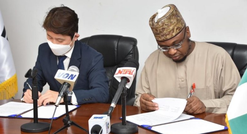 Nigeria's Minister of Communication and Digital Economy, Dr Isa Pantami and a Korean official during the signing of the MoU. [NAN]