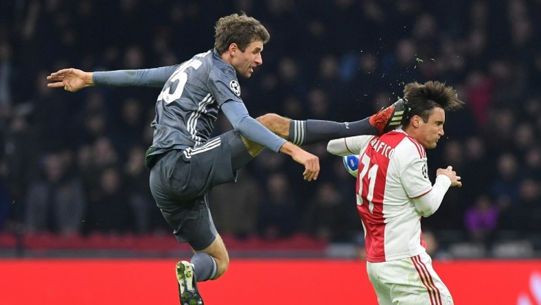 Bayern Munich striker Thomas Mueller is suspended for both legs of their Champions League last 16 matches against Liverpool for this kick on Ajax's Argentine defender Nicolas Tagliafico during December's 3-3 draw in Amsterdam in the group stages.
