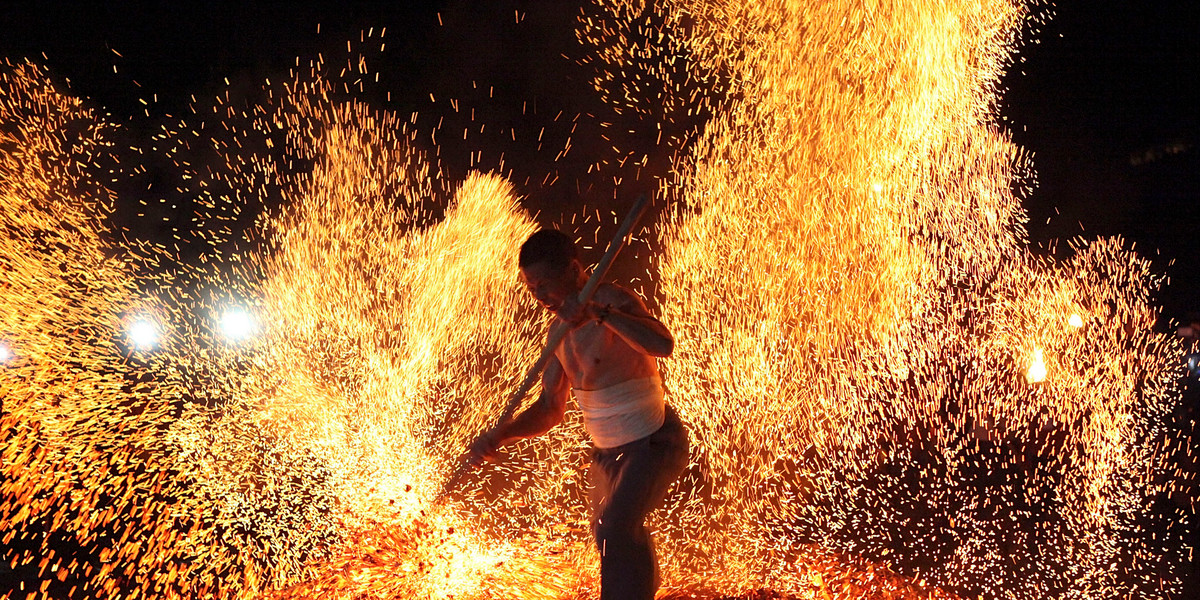 A man participating in the traditional ritual called "Lianhuo," or "fire walking," in Pan'an county, Zhejiang province, in 2013.