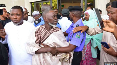 Lamidi Apapa being whisked away by security operatives after Obidients attacked him at the Appeal Court, Abuja [TheWhistle]
