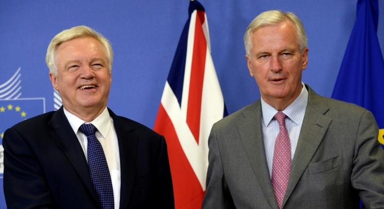 Britain's Brexit Minister David Davis (L) and European Union Chief Negotiator in charge of Brexit negotiations Michel Barnier pictured prior to their meeting at the European Union Commission headquarter in Brussels on July 17, 2017