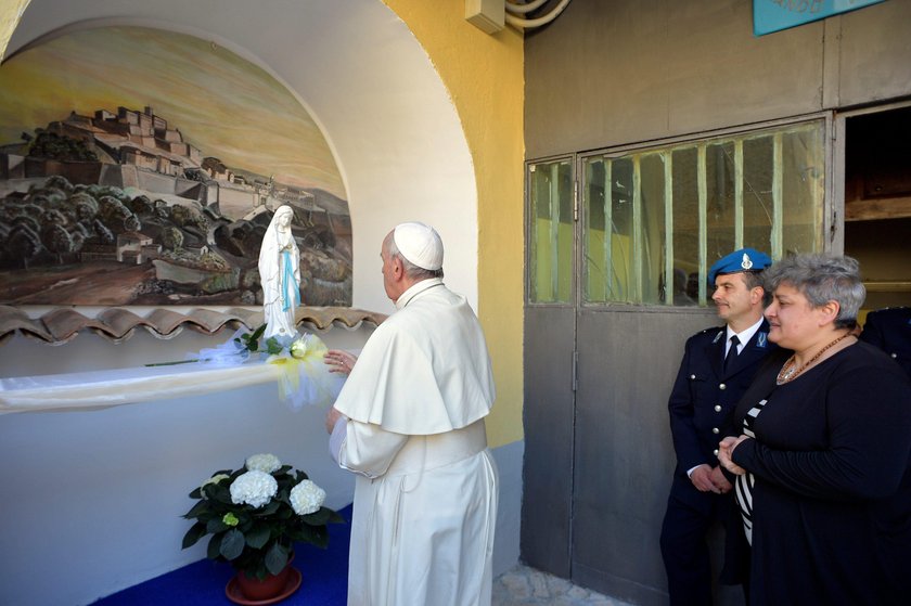 Pope Francis washes the feet of some inmates at the Paliano prison, south of Rome