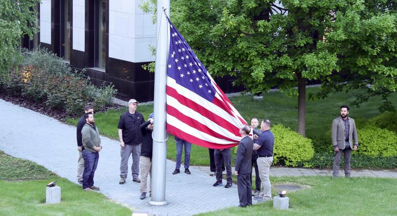 The US flag is raised at the US Embassy in Kyiv, which resumed work three month after Russia's invasion of Ukraine, May 18, 2022.
