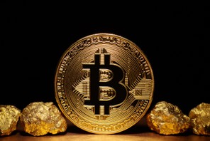 Golden Bitcoin Coin and mound of gold on black background