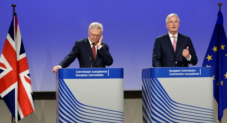 EU Brexit negotiator Michel Barnier (R) says after talks with his British counterpart David Davis that the two sides remain at odds on Britain's divorce bill and over the rights of European citizens living in Britain