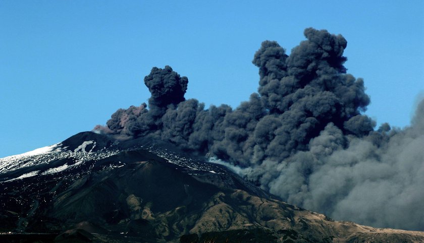 FILE PHOTO: Italy's Mount Etna, Europe's tallest and most active volcano, spews lava as it erupts on