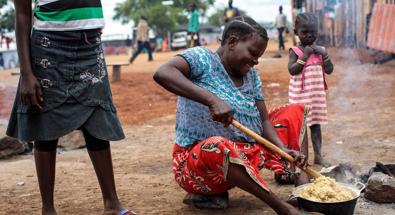 Refugees from the Democratic Republic of Congo cook food in the Kagoma reception centre within the Kyangwali settlement on April 10, 2018 in Kyangwali, Uganda.