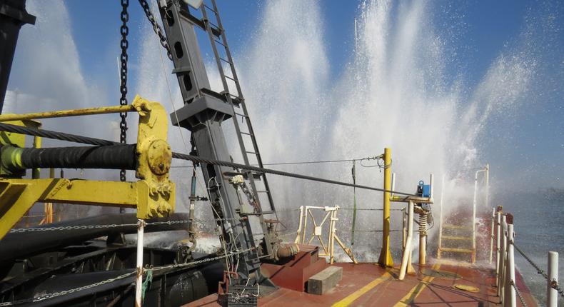 The US Army Corps of Engineers flushes the water jets of a dredge's suction head.USACE