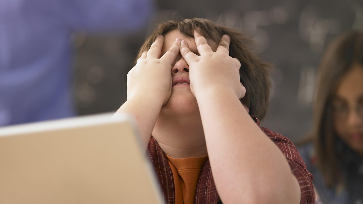 Frustrated Schoolboy with Laptop