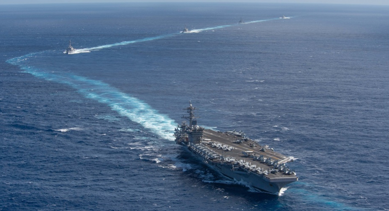 The Theodore Roosevelt Carrier Strike Group transits in formation Jan. 25, 2020. The Theodore Roosevelt Carrier Strike Group is on a scheduled deployment to the Indo-Pacific