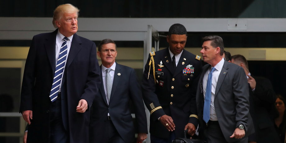 Trump leaving the CIA headquarters with Michael Flynn after delivering remarks during a visit in Langley, Virginia, on January 21.