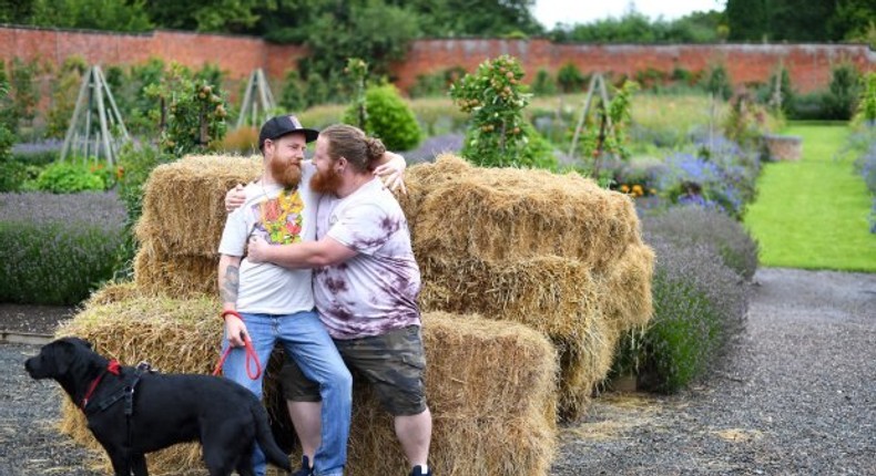 Groom and best man take pre-wedding picture