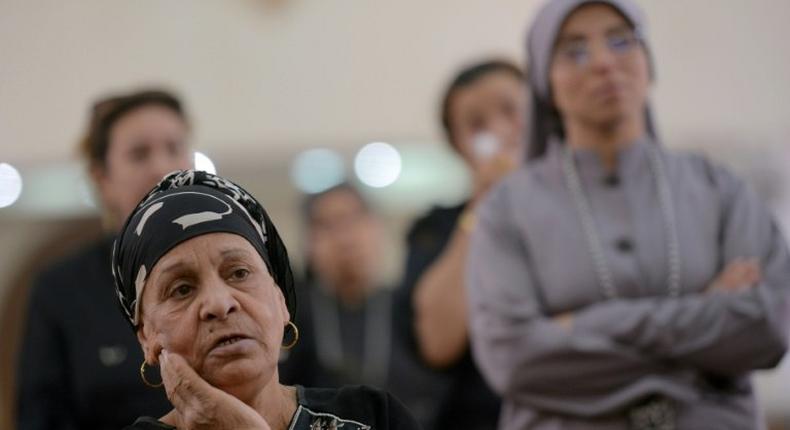 Egyptians attend mass at St Mark's Coptic Orthodox Cathedral in Bani Mazar on May 27, 2017 a day after the bus massacre