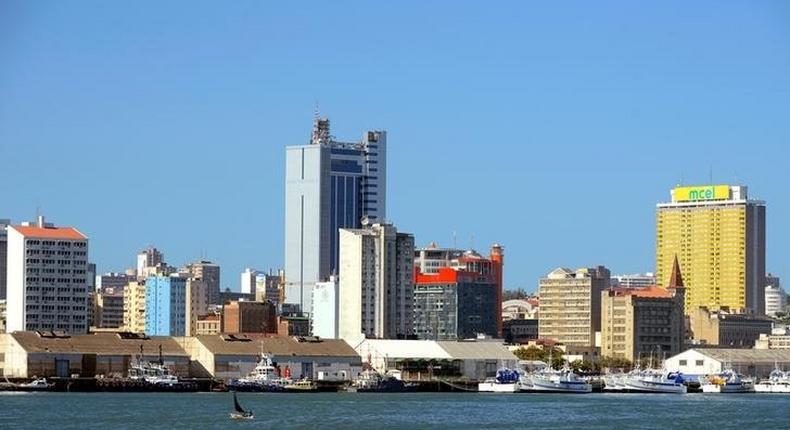 Fishing boats sit beneath the skyline of Mozambique's capital Maputo, April 15, 2016. Picture taken April 15, 2016. 