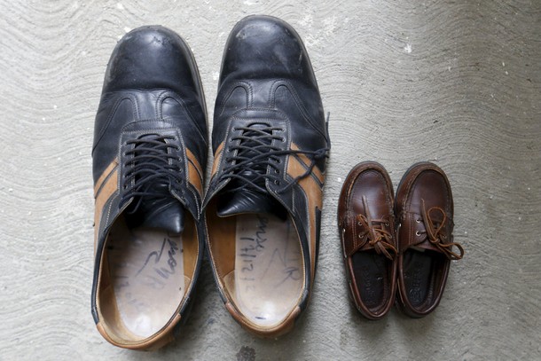 The shoes of Jeison Rodriguez (L), the living person with the largest feet in the world, are seen ne