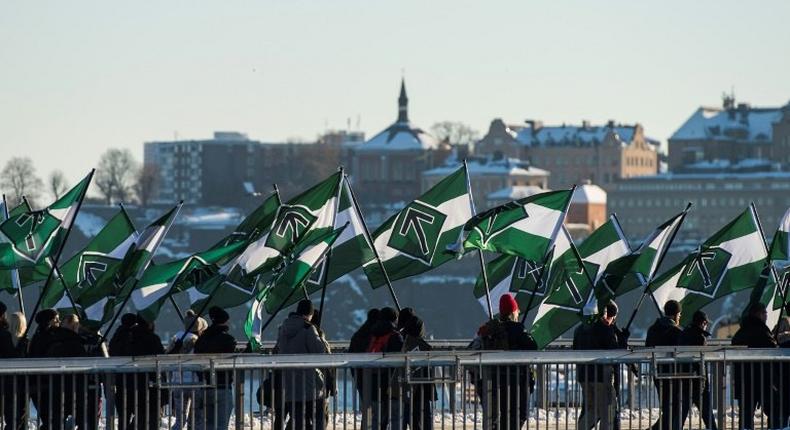 The neo-nazi Nordic Resistance Movement sympathisers demonstrate in central Stockholm on November 12, 2016 to protest against migrants