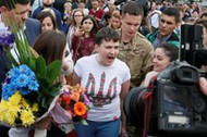 Ukrainian servicewoman Nadiya Savchenko and her sister Vera Savchenko walk at Boryspil International