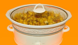 It's easy to make your favorite stuffing recipe in a slow cooker instead of inside the turkey.benedek/Getty Images