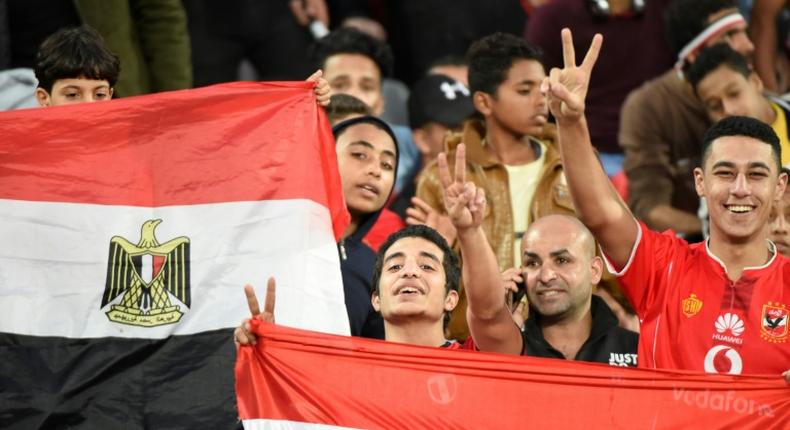 Egyptian fans cheer for their team ahead on an Africa Cup of Nations qualifier football match against Tunisia at the Borg El Arab Stadium near Alexandria on November 16, 2018