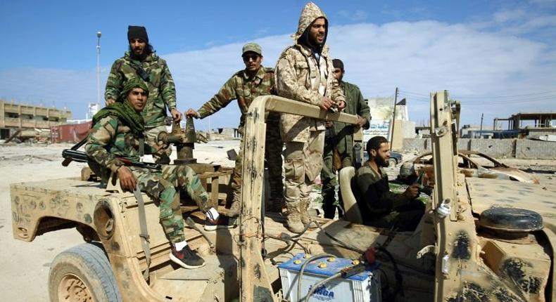 Members of the Libyan National Army (LNA), also known as the forces loyal to Marshal Khalifa Haftar, patrol the area of Qanfudah, on the southern outskirts of Benghazi