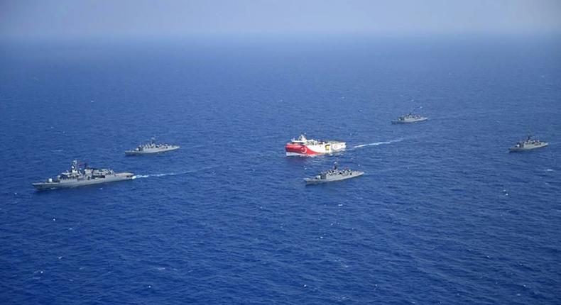 The Turkish Oruc Reis research ship, accompanied by a small navy fleet, sails into disputed Mediterranean waters