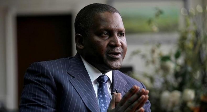 Founder and Chief Executive of the Dangote Group Aliko Dangote gestures during an interview with Reuters in his office in Lagos, Nigeria, June 13, 2012.     REUTERS/Akintunde Akinleye/File Photo
