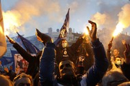 Supporters of Serbian ultra-nationalist leader Seselj light flares during an anti-government rally B