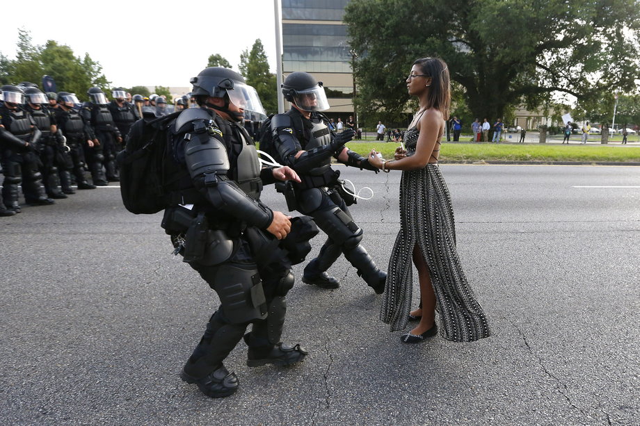 A demonstrator protesting the shooting death of Alton Sterling is detained by law enforcement near the headquarters of the Baton Rouge Police Department in Louisiana, July 9, 2016.