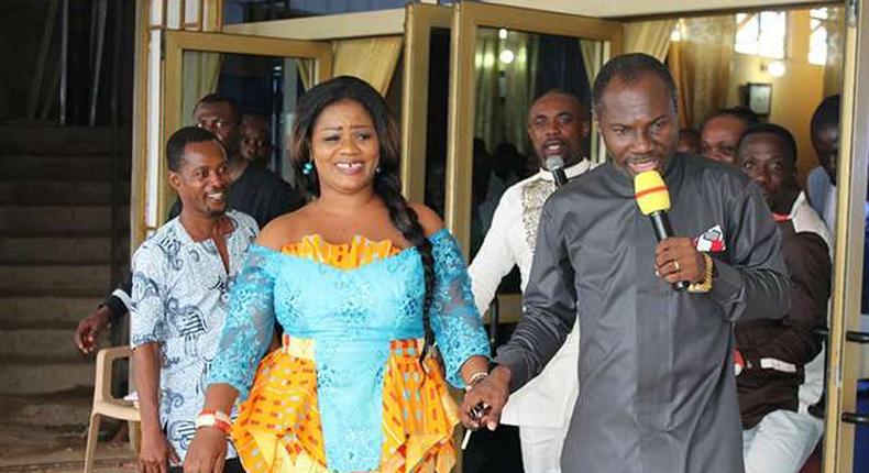 Obaapa Christy being led to her car by Prophet Badu Kobi