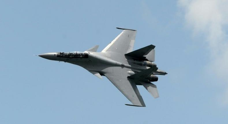 China has denied US allegations that two Chinese Sukhoi SU-30 fighter jets -- like this one from the Royal Malaysian Air Force -- intercepted an American military plane earlier this week, saying its aircrafts were acting in accordance with the law